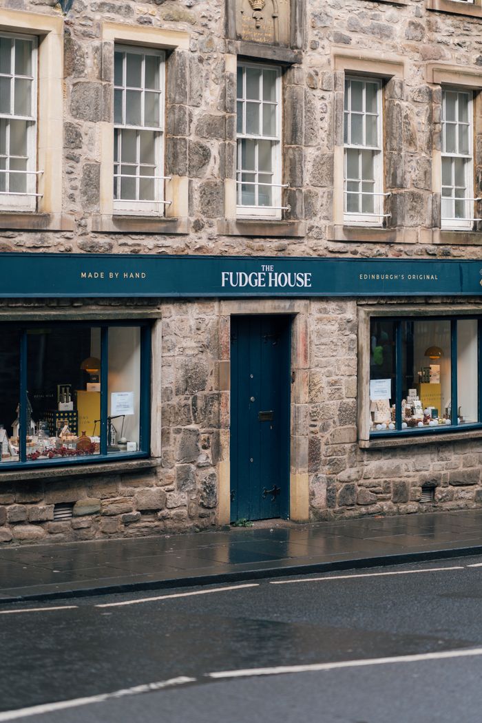 Street view of The Fudge House with stone facade, Edinburgh, highlighting local charm.